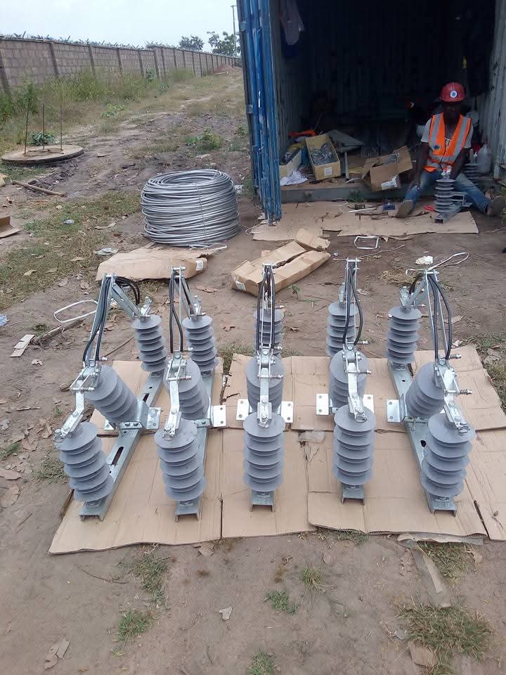 Distribution disconnect switches and insulators laid out on site prior to installation