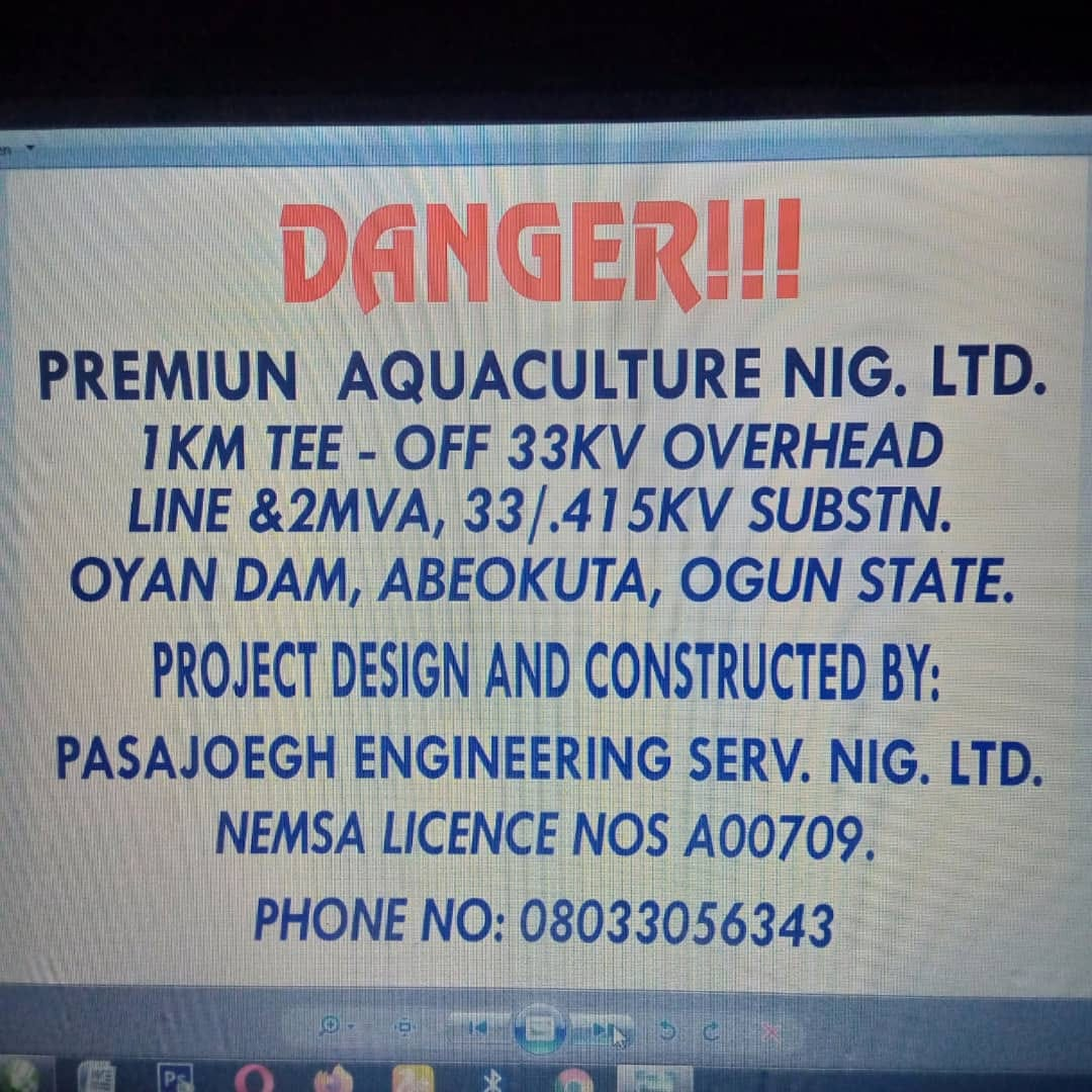 Project signboard reading Premium Aquaculture Nigeria Limited, 1km tee-off 33kV overhead line and 2MVA 33/0.415kV substation, Oyan Dam, Abeokuta, designed and constructed by Pasajoegh Engineering Services Nigeria Limited