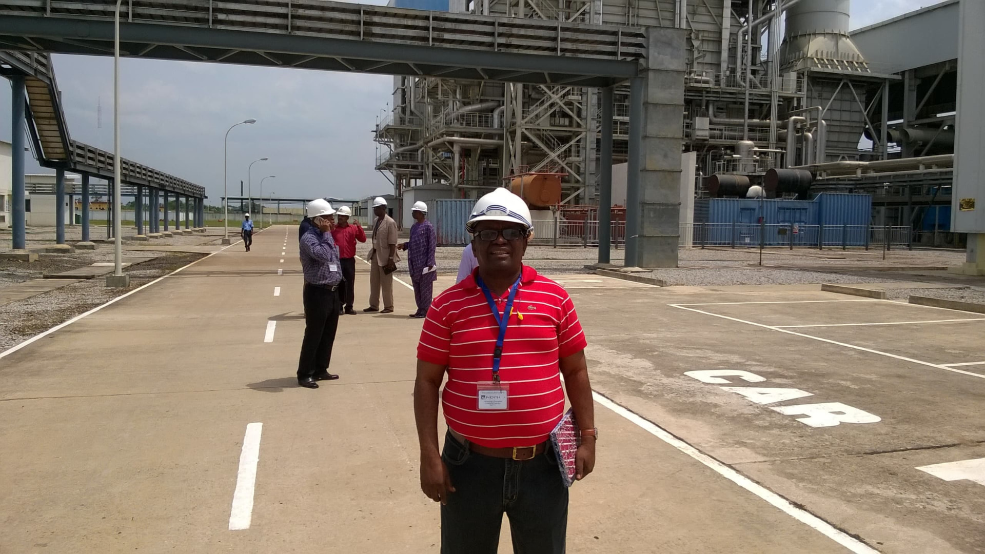 Engr. Francis Okosobo-Ibe wearing a hard hat at a gas-fired power generation facility